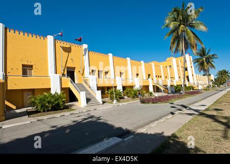 Horizontal view of the bullet holed front of Moncada Barracks in Santiago de Cuba, Cuba. Stock Photo