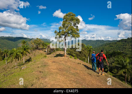 Horizontal view of tourists enjoying the scenery in Topes de Collantes National Park in Cuba. Stock Photo