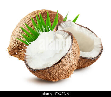 Coconuts with milk splash and leaf isolated on white background. Stock Photo