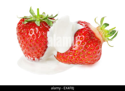 juicy strawberries in cream on the white background. Stock Photo