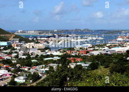 A vantage point shot of yachts berthed and at anchor in Simpson Bay Lagoon in Sint Maarten, Dutch Caribbean, on a steaming hot w Stock Photo