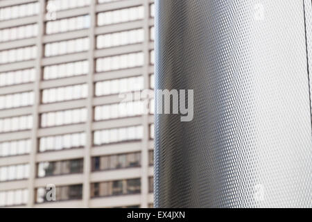 metal surface with office windows in the background Stock Photo