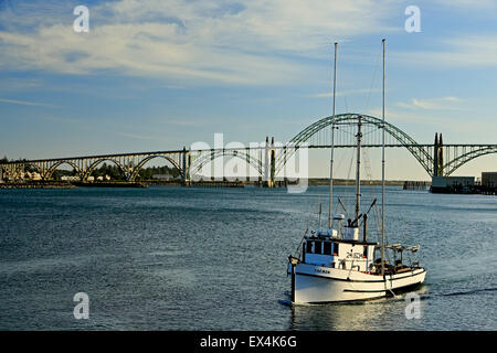 Fishing boat and Yaquina Bay Bridge, Newport, Oregon USA Stock Photo