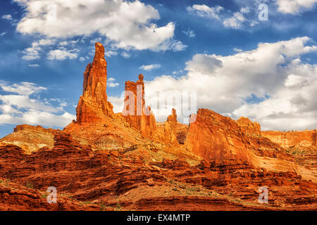 Monster Tower and Washing Woman Arch dominate the morning sky from remote Buck Canyon in Utah's Canyonlands National Park. Stock Photo
