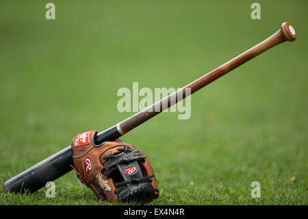 Milwaukee, WI, USA. 7th July, 2015. A glove and Fungo bat sit on the infield grass prior to start of the Major League Baseball game between the Milwaukee Brewers and the Atlanta Braves at Miller Park in Milwaukee, WI. John Fisher/CSM/Alamy Live News Stock Photo