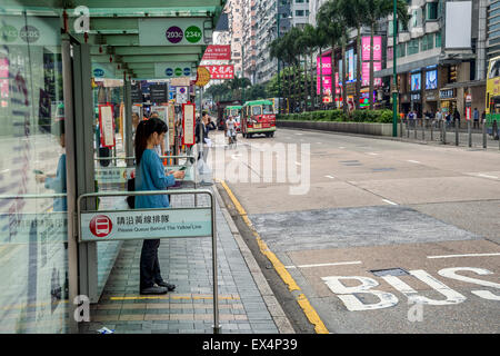 Chinese people waiting for the bus in hong kong Stock Photo