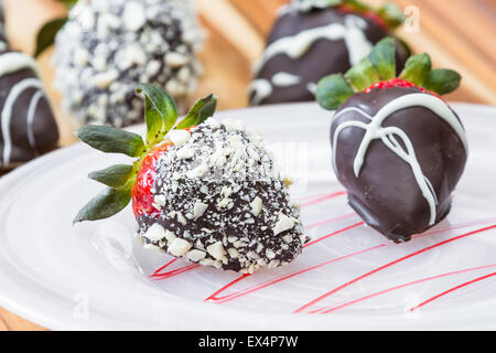 Hand dipped strawberries in chocolates served in two different styles Stock Photo