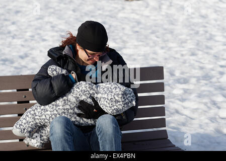 Nude mother breastfeeding her baby Stock Photo - Alamy