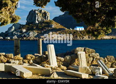 Ruins of the Christian Basilica of Agios Stefanos overlooking Monastery of Ayios Autonis on Kastri Island, Kos, Greece. Stock Photo