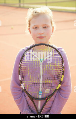 Young Girl Holding Tennis Racket