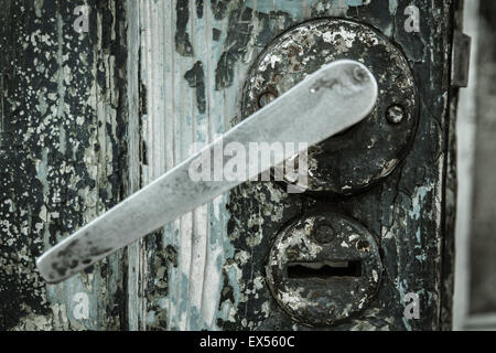 Closed old door in an abandoned house Stock Photo