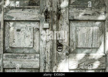 Closed old door in an abandoned house Stock Photo