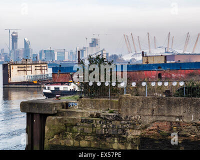 London Greenwich Thames riverside, urban art clocks, the O2 Arena and distant buildings Stock Photo