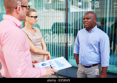 Modern business group having meeting outdoors Stock Photo