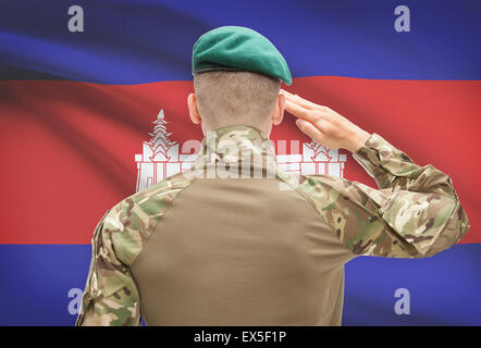 Soldier in hat facing national flag series - Cambodia Stock Photo