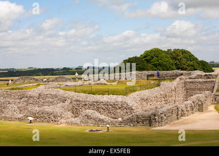 Visitors exploring Iron Age hill fort hillfort at Old Sarum, near Salisbury, Wiltshire UK in July Stock Photo