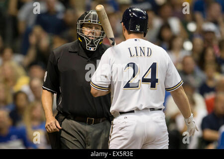 Milwaukee, WI, USA. 7th July, 2015. Milwaukee Brewers first baseman Adam Lind #24 discusses a third strike call with the home plate umpire during the Major League Baseball game between the Milwaukee Brewers and the Atlanta Braves at Miller Park in Milwaukee, WI. Atlanta defeated Brewers 5-3. John Fisher/CSM/Alamy Live News Stock Photo