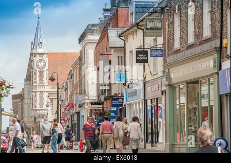 Looking north along New Street and Cornhill in Dorchester, Dorset, England, UK. Showing the clock tower of the Corn Exchange. Stock Photo