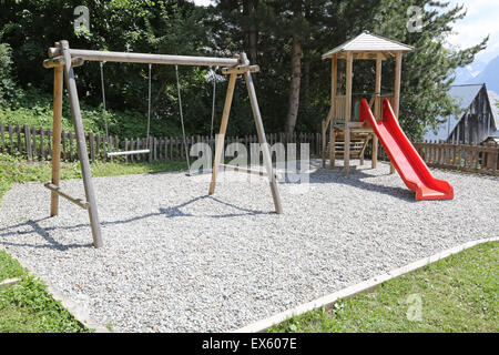 Empty activities at a kids playground in the summer Stock Photo