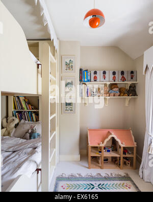 Osborn and Little striped wallpaper in kids bedroom with bunk beds and Polish folk rug Stock Photo