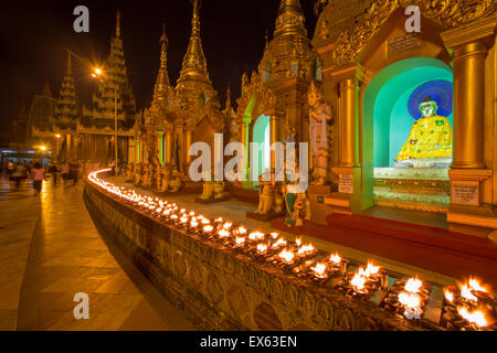 Shwedagon pagoda candle offerings, Yangon, Myanmar Stock Photo