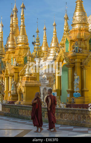 Monks at Shwedagon pagoda, Yangon, Myanmar Stock Photo