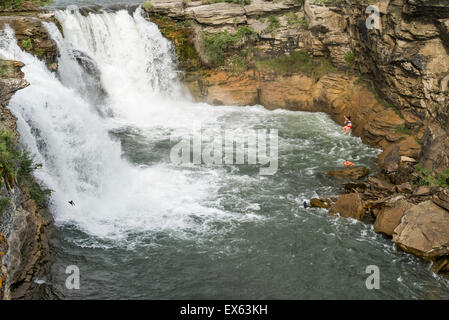 Cliff jumpers at Lundbreck Falls on the Crowsnest River, , Alberta Provincial Recreation Area, Crowsnest Pass Region, Alberta, C Stock Photo