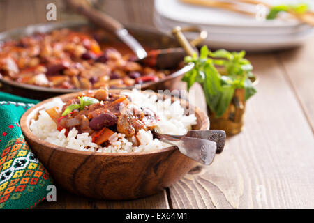 Vegan chili with beans, mushrooms, and vegetables served on rice Stock Photo