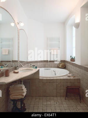 interior view of classic bathroom with tile floor overlooking on bathtub Stock Photo