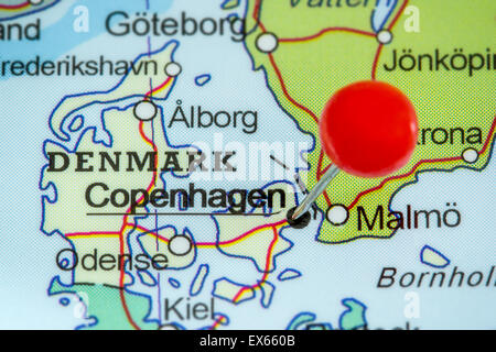 Close-up of a red pushpin on a map of Copenhagen, Denmark Stock Photo
