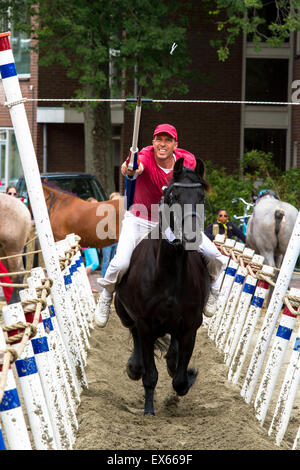 Europe, Netherlands, Zeeland, Walcheren, ring riding in Oostkapelle, the rider must skewering a small ring with a lance while ga Stock Photo