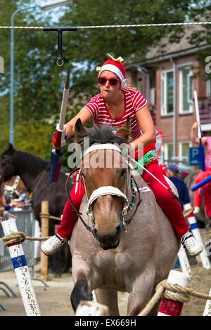 Europe, Netherlands, Zeeland, Walcheren, ring riding in Oostkapelle, the rider must skewering a small ring with a lance while ga Stock Photo