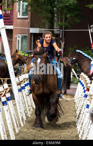 Europe, Netherlands, Zeeland, Walcheren, ring riding in Oostkapelle, the rider must skewering a small ring with a lance while ga Stock Photo