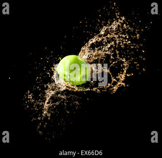 Green apple with water splash on black background Stock Photo