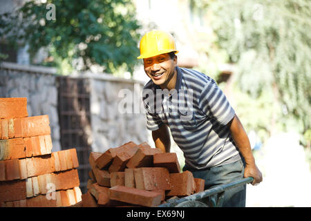 Bricklayers at construction site Stock Photo