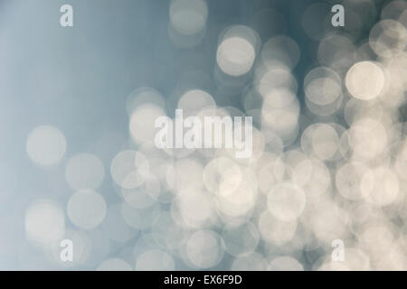 Background with soft delicate light circles made from water glow. Stock Photo