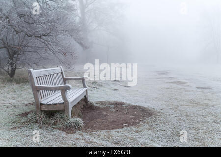 Frosty bench in the fog Wandlebury Country park Gog Magog Hills Cambridge Stock Photo