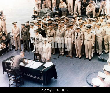 General Douglas MacArthur (1880-1964) watches as representatives of Japan stand aboard USS Missouri prior to signing of the Instrument of Surrender ending World war two, dated September 2, 1945 Stock Photo