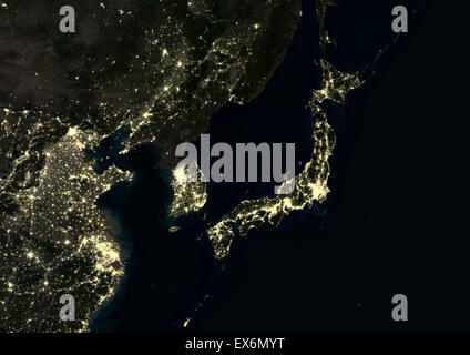 Japan and Korean Peninsula at night in 2012. This satellite image shows urban and industrial lights. Stock Photo