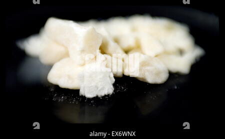 Crack cocaine is the freebase form of cocaine that can be smoked. It may also be termed rock, work, hard, iron, cavvy, base, or just crack; it is said to be the most addictive form of cocaine. Crack rocks offer a short but intense high to smokers. Stock Photo