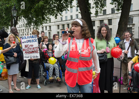 London, 08th July 2015. Protesters against Chancellor George Osbourne's budget come together in a demonstration they call 'Balls to the budget'. Anti-austerity and disability campaigners released multi-coloured balls into Whitehall outside Downing Street in protest at what they see as a budget which persecutes and demonises benefit claimants, then marched past Parliament and blocked Westminster Bridge Credit:  Patricia Phillips/Alamy Live News Stock Photo