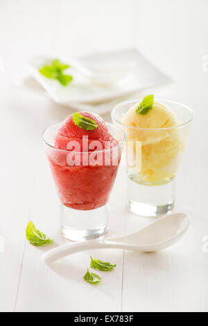 Fresh mixed fruit ice cream sorbet in glass. Stock Photo