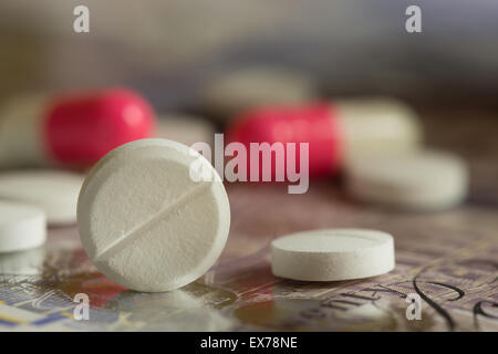 Mixture pills aspirin Ibuprofen painkiller over the counter without a prescription blue amitriptyline tricyclic antidepressant Stock Photo