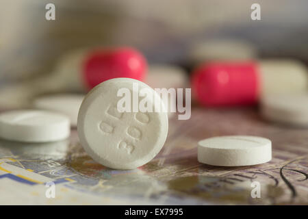 Mixture pills aspirin Ibuprofen painkiller over the counter without a prescription blue amitriptyline tricyclic antidepressant Stock Photo