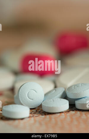 Mixture pills aspirin Ibuprofen painkiller over the counter without a prescription blue amitriptyline tricyclic antidepressant Stock Photo