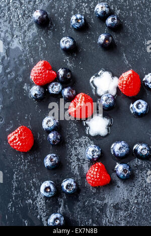 Mix of ripe berries on grey table, top view Stock Photo - Alamy