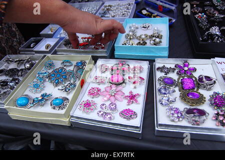 Colorful jeweleries and Rings on display at market stall Stock Photo