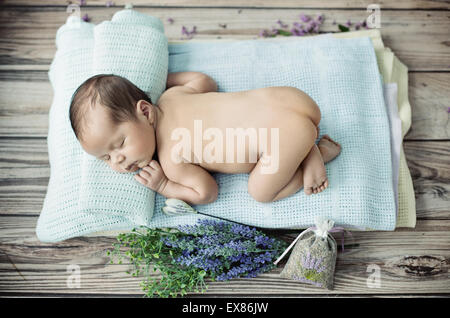 Cute little kid sleeping on the blanket Stock Photo