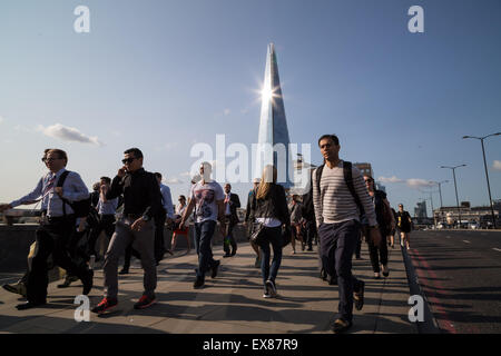 London, UK. 9th July, 2015. Morning commuters walk across London Bridge during tube strike Credit:  Guy Corbishley/Alamy Live News Stock Photo