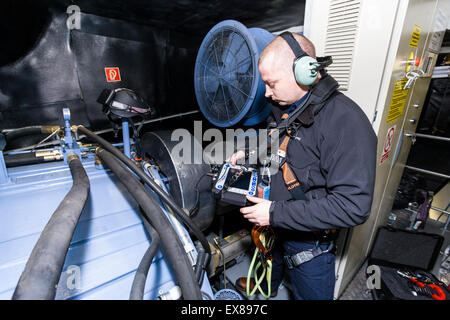 Engineer working in a wind turbine at the Caton Moor wind farm owned by Triodos Stock Photo